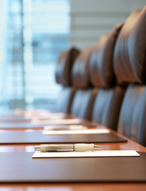 Conference room table with empty chairs