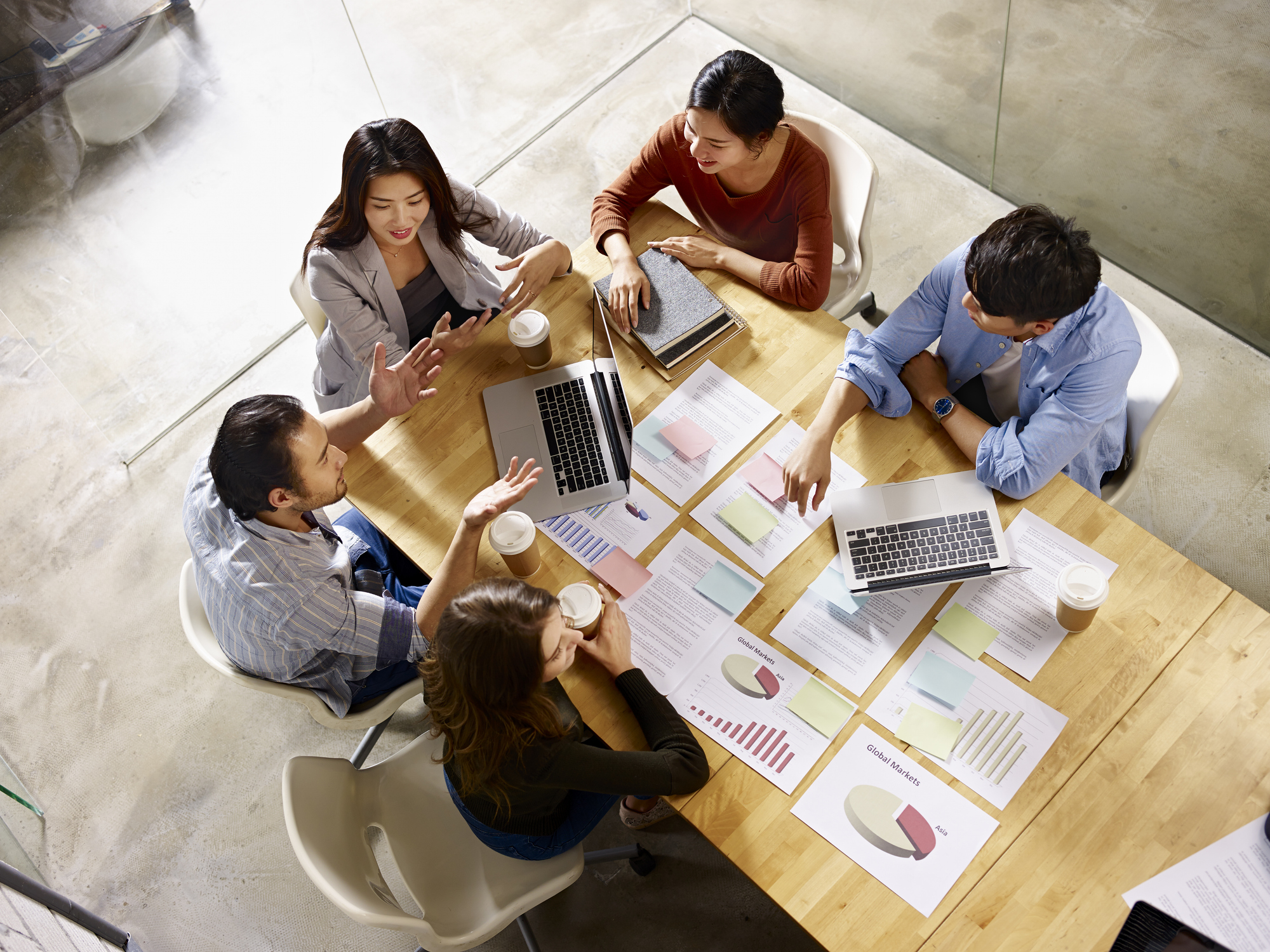 group of businesspeople gathered around a table