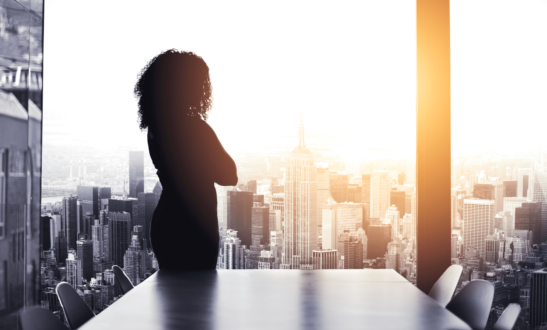retain top talent, leadership retention leadership opportunities, woman looking out over city