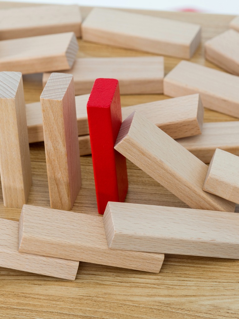 An image of falling dominos