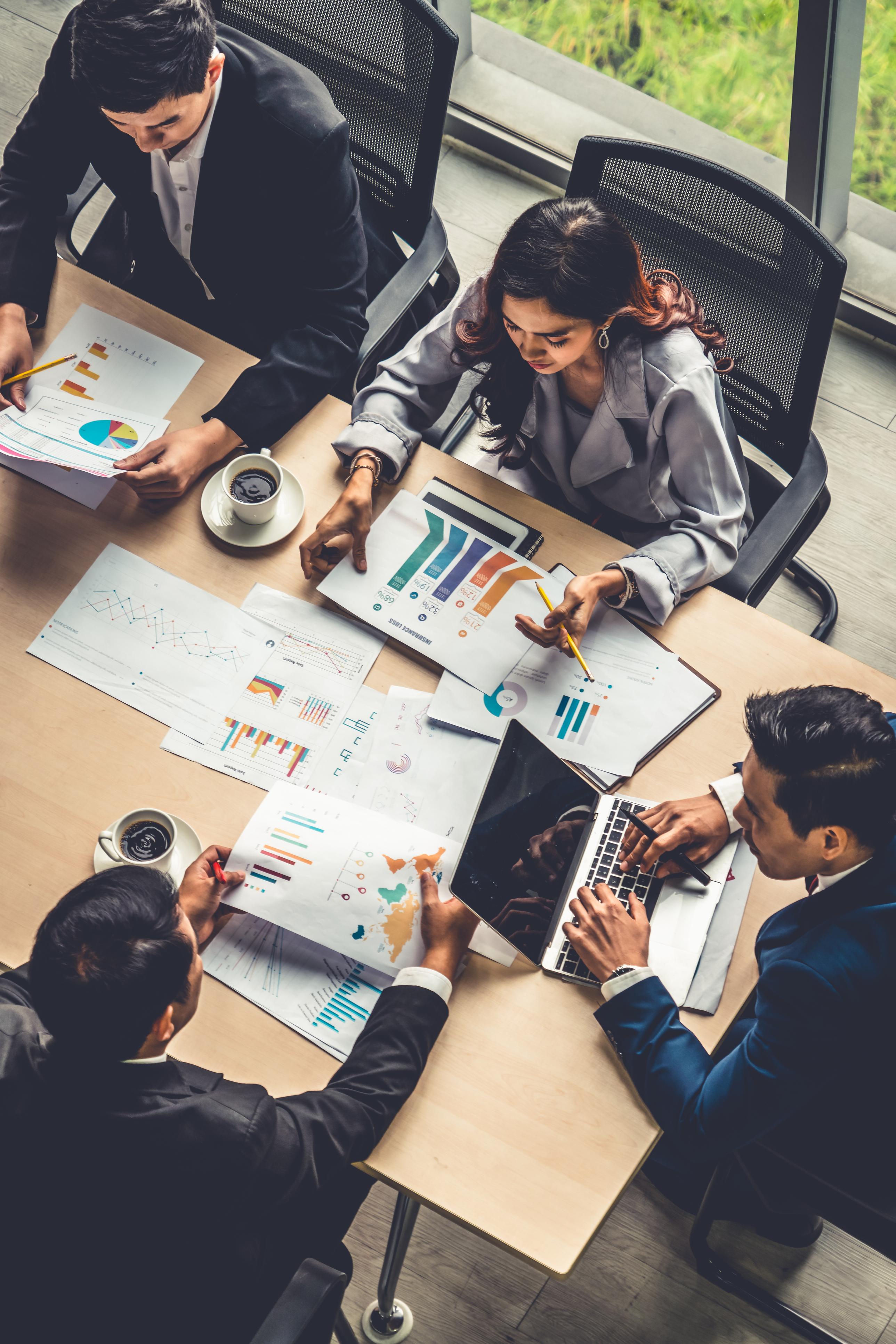Photo of business leaders meeting around a table